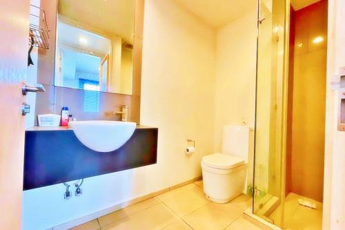 a bathroom with a sink and a toilet at unixx city ​​center high floor amazing sea view24f in Pattaya South