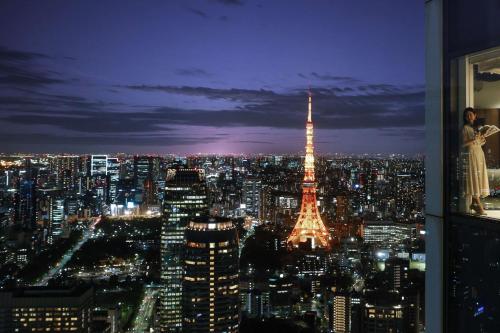 a view of the eiffel tower at night at Andaz Tokyo - A Concept by Hyatt in Tokyo