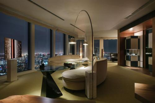 a living room with a view of a city skyline at Andaz Tokyo - A Concept by Hyatt in Tokyo