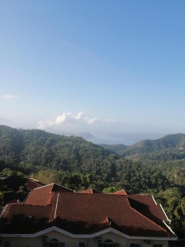 a view of the mountains from a house at Sang Yoo Mountain View Tagaytay Bed and Breakfast - Taal Lake View in Tagaytay