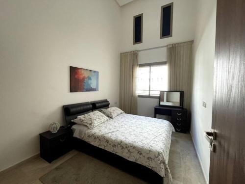 Ένα ή περισσότερα κρεβάτια σε δωμάτιο στο Luxury apartment 5 minutes Casablanca Airport