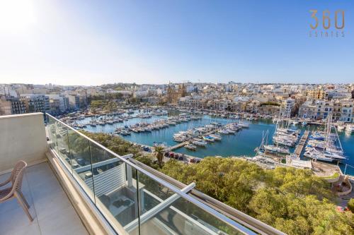 a balcony with a view of a marina at Modern 3BR home with Stunning Marina View in Pieta by 360 Estates in Tal-Pietà