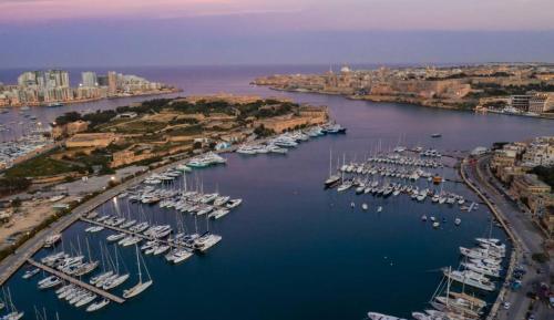 an aerial view of a harbor filled with boats at Modern 3BR home with Stunning Marina View in Pieta by 360 Estates in Tal-Pietà