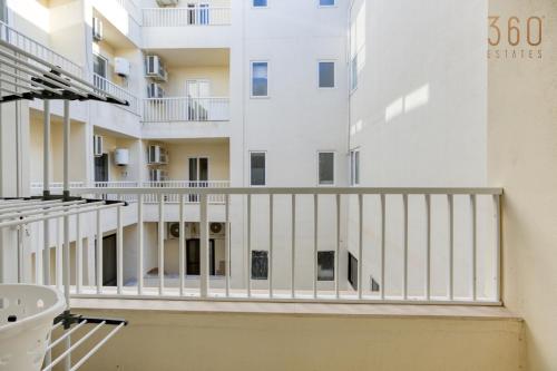 a view of a building from the balcony of a building at Modern 3BR home with Stunning Marina View in Pieta by 360 Estates in Tal-Pietà