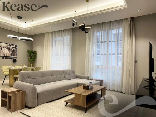 a living room with a couch and a table at Kease Malqa D-12 Royal Touch GZ20 in Riyadh