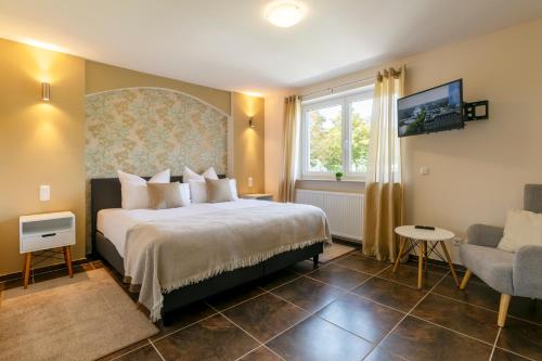 Postel nebo postele na pokoji v ubytování MEMORY - Ferienapartments & Zimmer - Mediterraner Flair in der Rhön