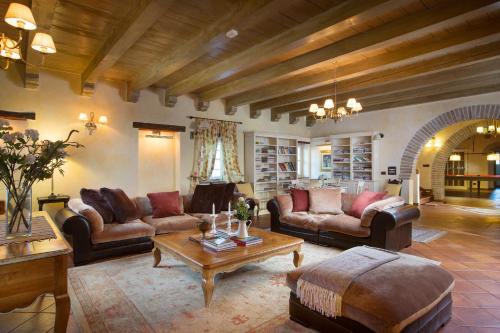 a large living room with couches and a coffee table at Villa LOU in Poreč