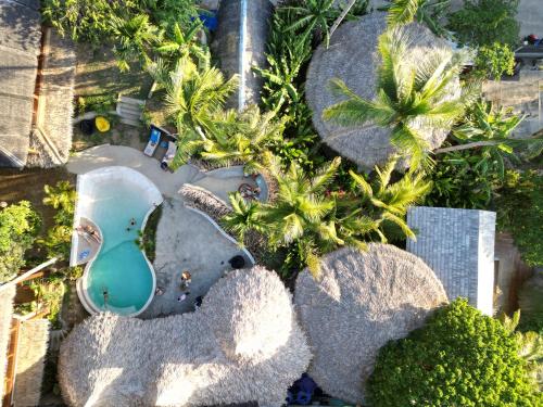 an aerial view of a swimming pool in a resort at Happiness Boutique Resort in El Nido