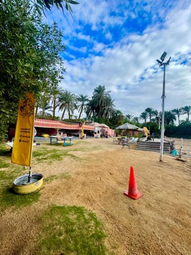 a red cone sitting in the middle of a park at 2-single beds beit zeina horse riding in Cairo