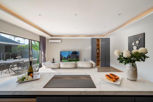 a living room with a couch and a table at Sea&Sky Beach Resort in Mae Nam