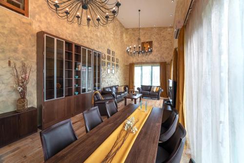 a conference room with a long table and chairs at Serenity Villas in Kolimbia