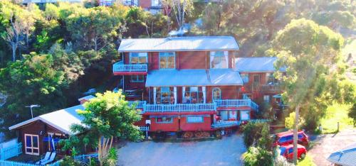 an aerial view of a large house on a hill at The Goat and Goose Bed & Breakfast in Lakes Entrance
