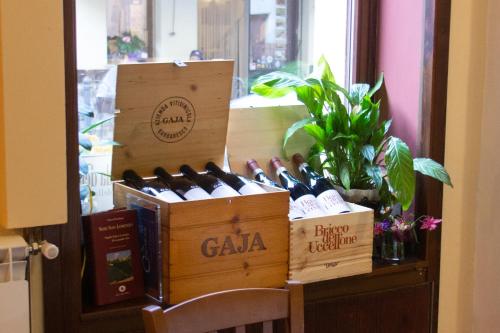 two boxes of wine sitting on top of a table at Albergo Santo Spirito in Molini di Triora
