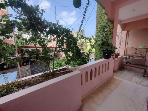 a balcony of a house with plants on it at Rest and Relax Homestay in Puducherry