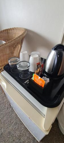 a tray with utensils on top of a table at Greystone Guesthouse in Jeffreys Bay