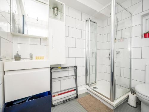 a bathroom with a shower and a toilet at Newly renovated by British Museum - Pass the Keys in London