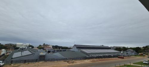 an overhead view of a building with solar panels at Greystone Guesthouse in Jeffreys Bay