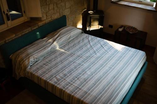Llit o llits en una habitació de La casina-Maisonette