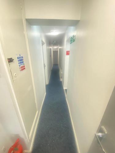 a hallway with a long aisle in a room at Pacific hotel in Clacton-on-Sea