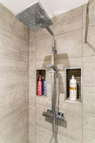 a shower with a shower head in a bathroom at Stunning Ground Floor Hartlepool Marina Apartment in Hartlepool