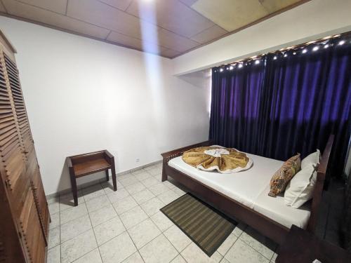 Ein Bett oder Betten in einem Zimmer der Unterkunft Foyer du Marin - Deutsche Seemannsmission Douala
