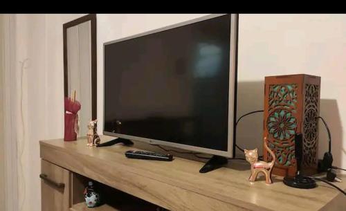 a flat screen tv sitting on top of a entertainment center at Apartamento Lapa in Rio de Janeiro