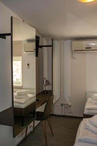 Postel nebo postele na pokoji v ubytování Golden Golem hotel & Spa