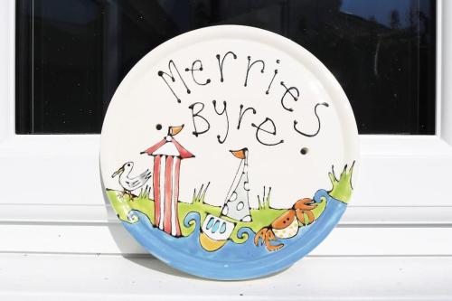 a plate with a happy bunny written on it at Welcoming Southwold Holiday Home in Southwold