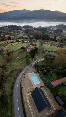 an aerial view of a road and a swimming pool at Casas da Madrinha in Arcos de Valdevez