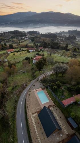 an aerial view of a road and a swimming pool at Casas da Madrinha in Arcos de Valdevez