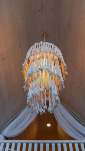 a chandelier hanging from a ceiling in a room at Casas da Madrinha in Arcos de Valdevez