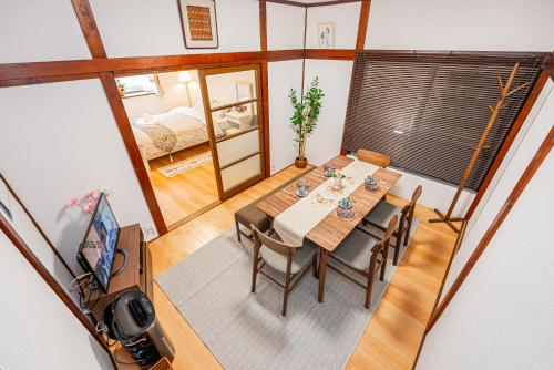 a dining room with a table and chairs at Himawari in Tokyo