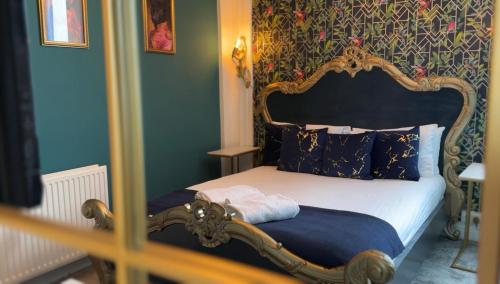 Ένα ή περισσότερα κρεβάτια σε δωμάτιο στο The Golden Fleece Inn
