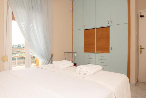 Ένα ή περισσότερα κρεβάτια σε δωμάτιο στο Magda's House