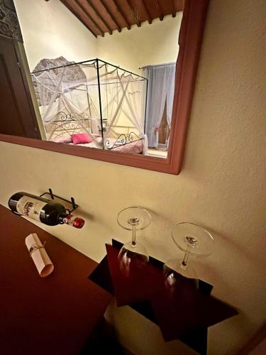 a bathroom with a mirror and two toilet paper holders at Agriturismo Tassinaia in Pontassieve