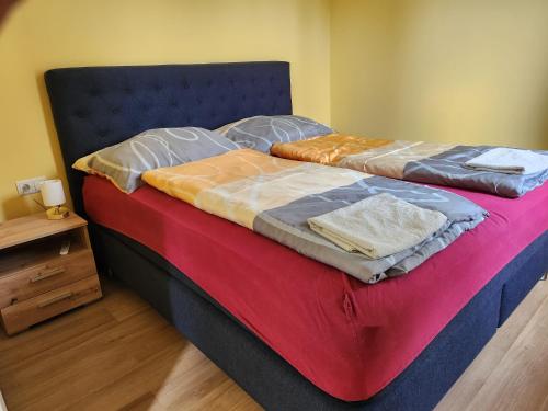two beds sitting next to each other in a bedroom at Haus Yuphin in Hart bei Graz