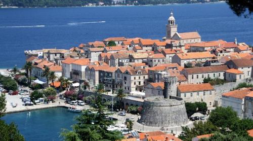 a town on the shore of a body of water at Rustical Apartment in Korčula