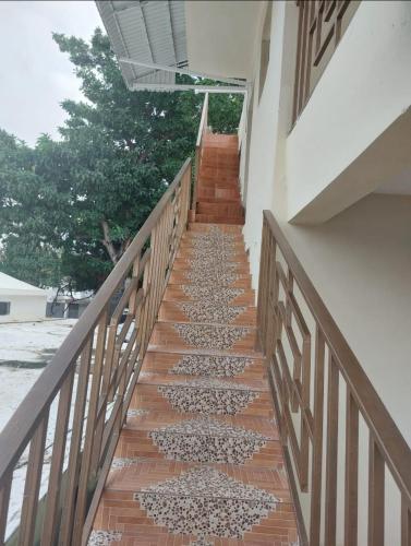 a stairway leading up to a building at New apartment close to everything in Santiago de los Caballeros