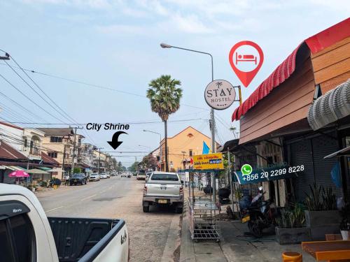 a city street with a truck parked on the street at STAY Hostel & Motorbike Rental - Thakhek in Thakhek