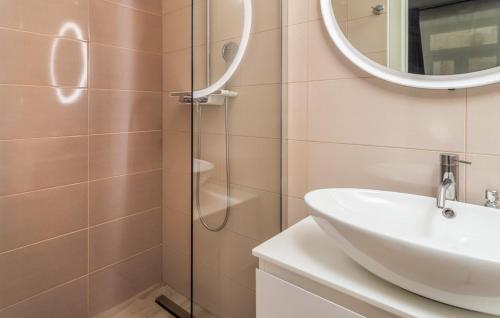 a bathroom with a sink and a shower at Rab Stari grad in Rab