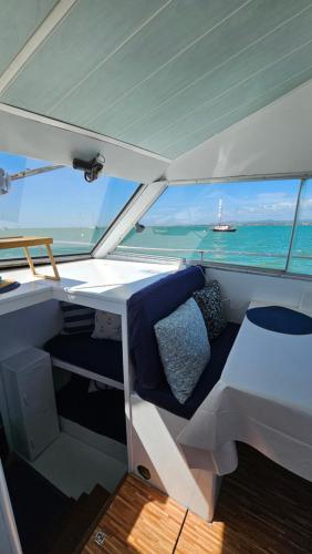 a view from the back of a boat with a bed at Tarasmaki - Boat House in Ilha da Culatra