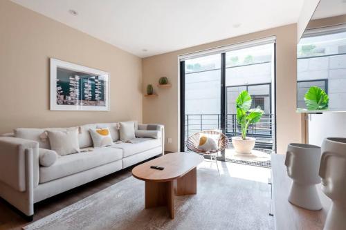 a living room with a white couch and a table at Magnific 2BR in Cuauhtemoc in Mexico City