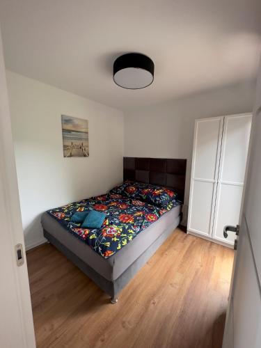 a bedroom with a bed in the corner of a room at BLUE BAY in Mosty