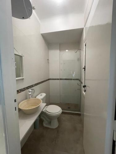 a bathroom with a toilet and a sink and a shower at Ana Rent lll in Boulogne