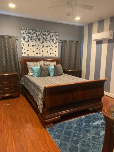 a bedroom with a large bed with blue pillows at Quiet Haven in Freeport