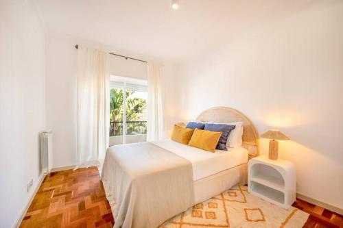 Rúm í herbergi á Casa Rosário - Three Bedroom Villa with Private Pool