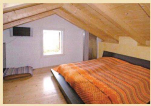 Postel nebo postele na pokoji v ubytování Rustico sopra Brissago