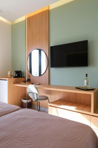 Una cama o camas en una habitación de Arocaria Apartments