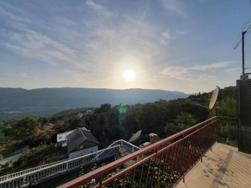 a view of the mountains from the balcony of a house at VILA MARTINA in Herceg-Novi