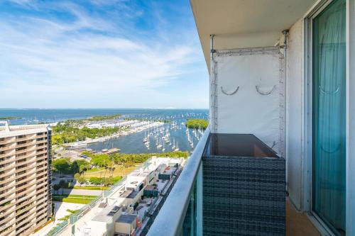 a balcony of a building with a view of a harbor at City View Balcony steps from Restaurants, Peacock Park & Marina in Miami